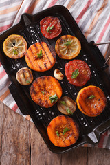 Grilled pumpkin closeup on grill pan. Top view vertical 
