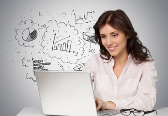 Laptop. Businesswoman posing near of laptop