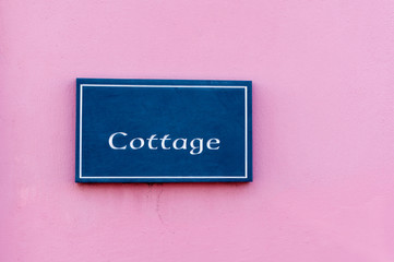Sign for 'Cottage' engraved on a tile
