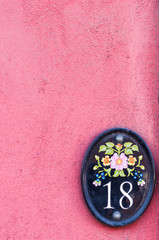 Obraz na płótnie Canvas House number Eighteen tile for use as a background