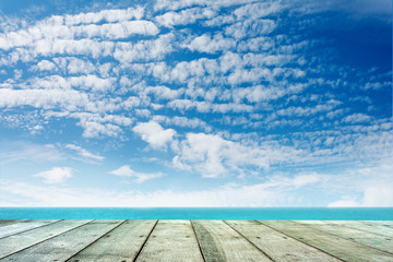 Wooden floor with sea background.