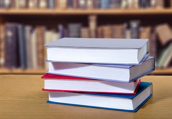 Book. A pile of books with library on the back