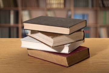 Book. A pile of books with library on the back