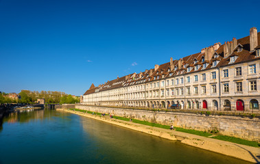 View of embankment in Besancon with tram on a bridge - France