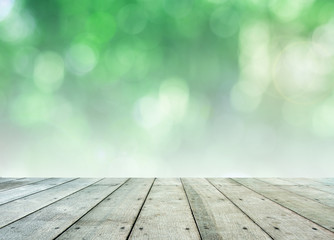 Leaf bokeh background with wooden paving.