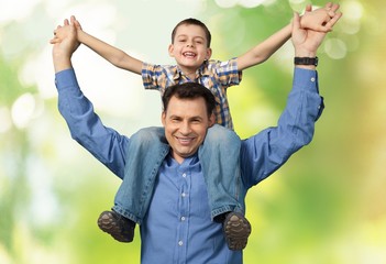 Father. Dad and Son Piggy Back with Blue Copy Space