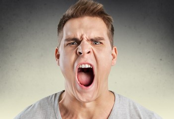 Anger. Portrait of young angry man