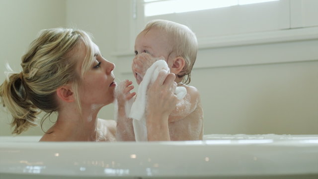 mother and baby taking a bubble bath
