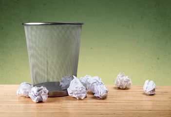Concept. Office garbage near metal basket