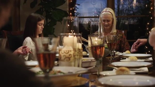 MS DS Family with children (2-5 months,2-9 years) praying at dining table / Cedar Hills,Utah,USA