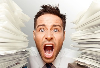 Emotional Stress. Wide-Eyed Office Worker Screams for Help btwn