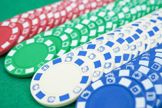 lots of poker chips on casino table