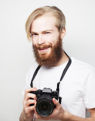 Fototapeta premium bearded man with a digital camera