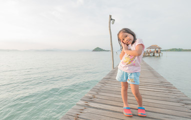 Portrait of asian cute girl stand on bridge.