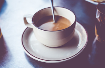 Vintage filter : Thailand Local coffee in cup on table,street ca