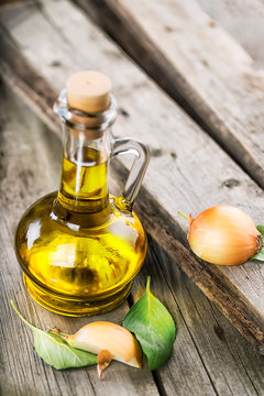 Decanter sunflower oil with onion slices