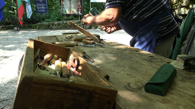 Master carves wood. 4K.
