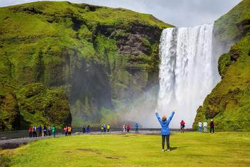 The woman - tourist shocked beauty waterfall