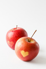 Red apples with a heart symbol