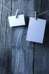 Blank note papers on wooden background