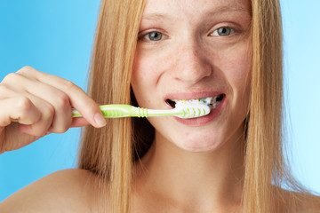 Woman brushing teeth