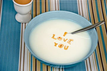 love message with cereal in white milk