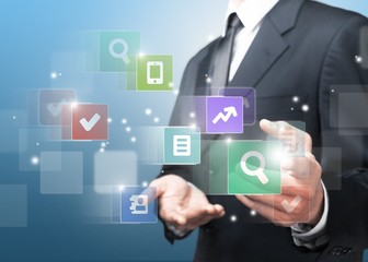 Internet. Businessman pressing application button on computer