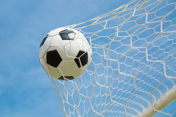 Fototapeta premium .Soccer ball in the goal after shooted