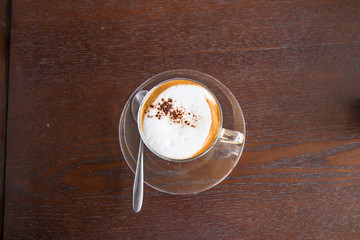 coffe latte cup on a wood table