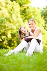 Fototapeta premium Mother and daughter learning about nature