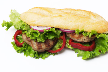 Sandwich with beef cutlet, lettuce, onions 