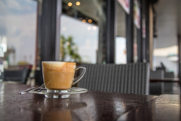 coffe latte cup on a wood table