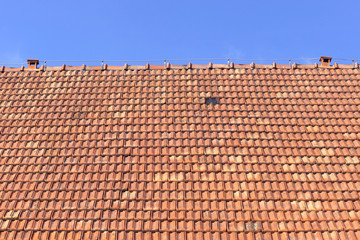 old roof of orange clay tiles