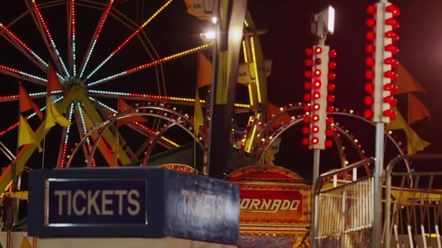Medium shot of Ferris Wheel and amusement park at night / Salt Lake City, Utah, United States