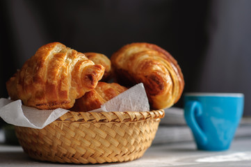Breakfast with fresh baked croissants, butter and coffee