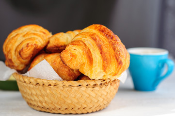 Breakfast with fresh baked croissants, butter and coffee