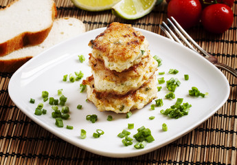 Homemade chicken cutlets sprinkled with green onion, selective f