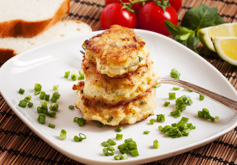 Homemade chicken cutlets sprinkled with green onion, selective f