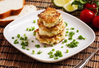 Homemade chicken cutlets sprinkled with green onion, selective f