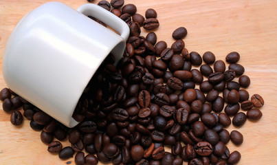 Roasted brown coffee beans,on wood background