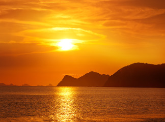 Naklejka na ściany i meble beautiful sunset on a tropical beach in Thailand