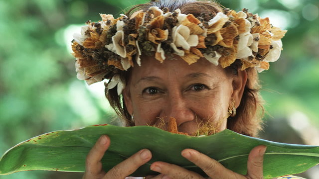 Pacific Islander Woman Smelling Food