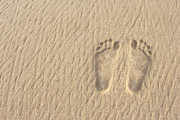 footprints on the sand beach