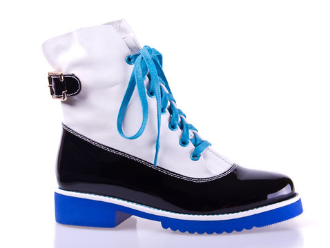 pair of  women's boots with blue sole