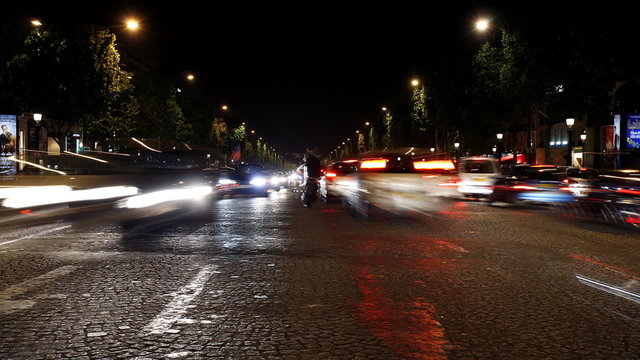 timelapse of a busy paris street at night
