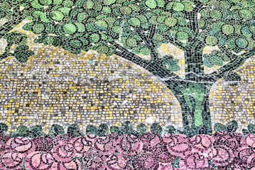 detail of an ancient mosaic, tree and rose garden of an unknown