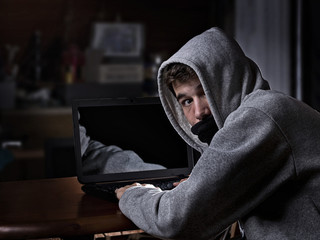 Hacker, trying to breach the security of a computer system