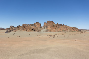 Fototapeta na wymiar Volcanic / desert landscape - sand , rocks,