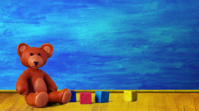 Children's room with aircraft, bear, cubes and peg-top.