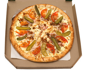 Pizza with vegetables and ham in a box